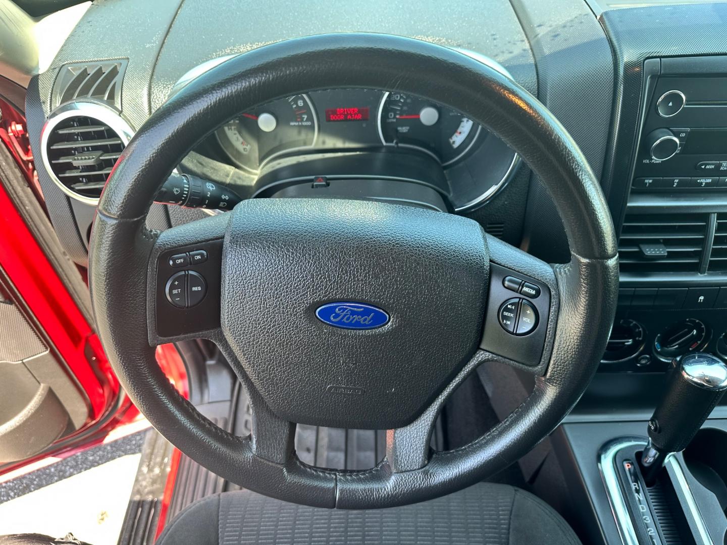 2009 Red /black Ford Explorer XLT (1FMEU73E89U) with an 4.0L V6 engine, 5-Speed Automatic transmission, located at 11115 Chardon Rd. , Chardon, OH, 44024, (440) 214-9705, 41.580246, -81.241943 - This 2009 Ford Explorer is a reliable and capable SUV, offering a 4.0L V6 engine paired with a 5-speed automatic transmission and full-time 4WD system. With a 3,500-pound towing capacity, it's suitable for moderate hauling needs. Additionally, the power driver's seat provides comfort and convenience - Photo#18